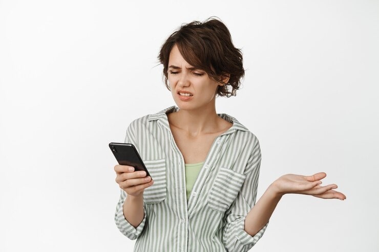 woman annoyed on phone not working