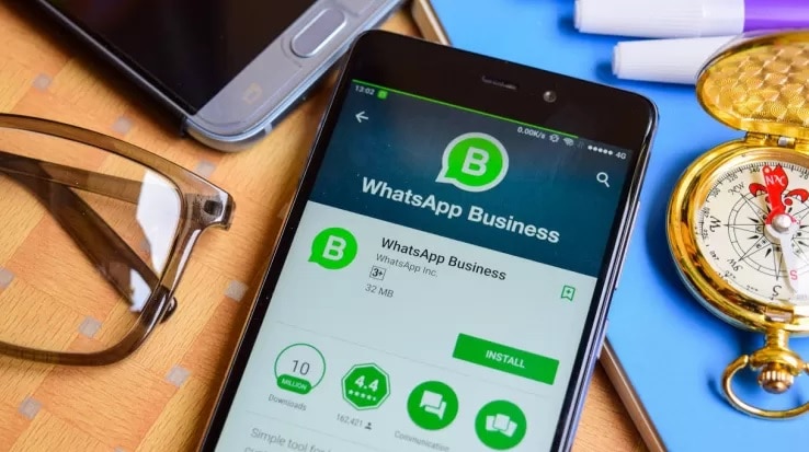 smartphone on whatsapp business download menu