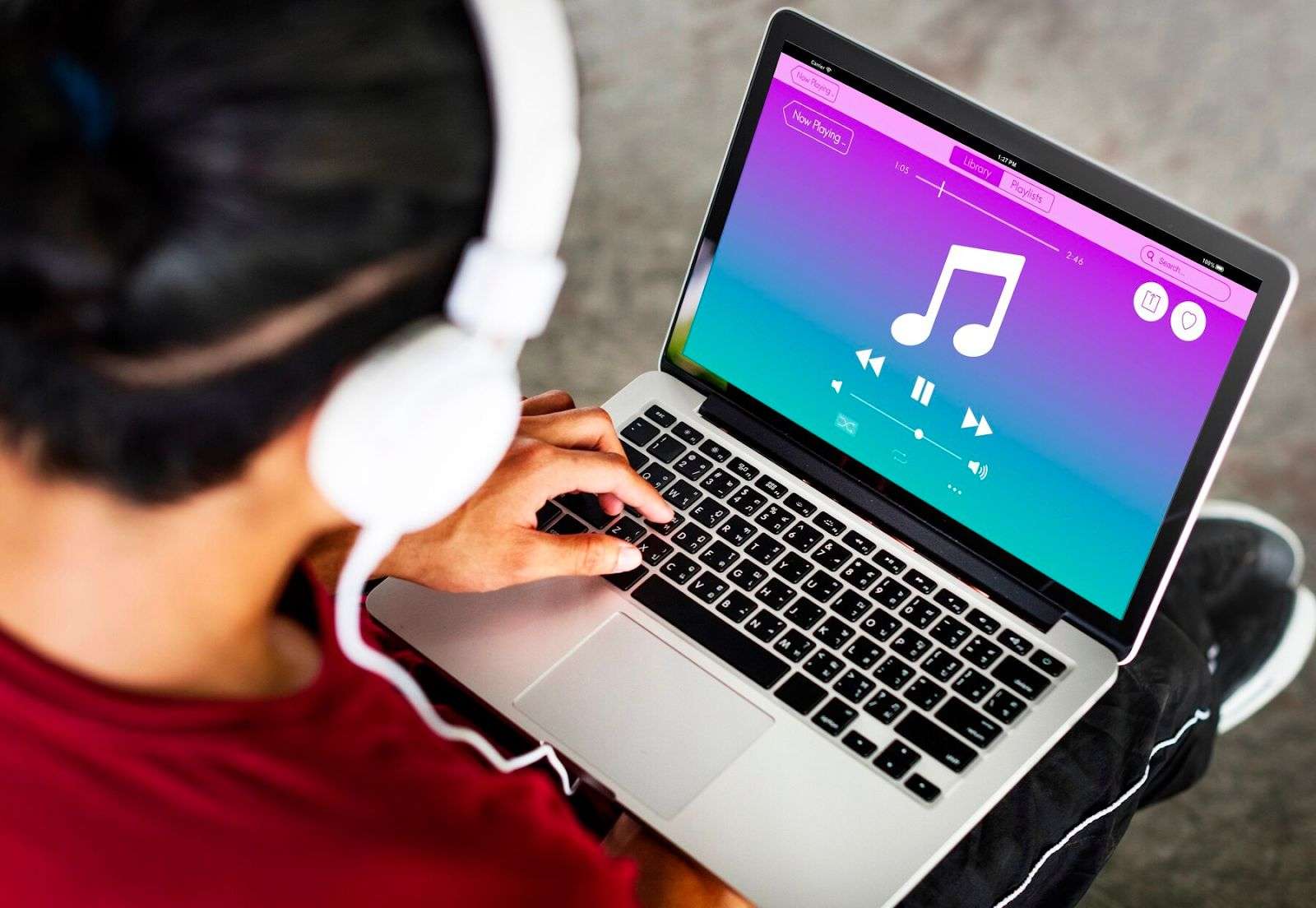 person listening to music from iTunes on mac