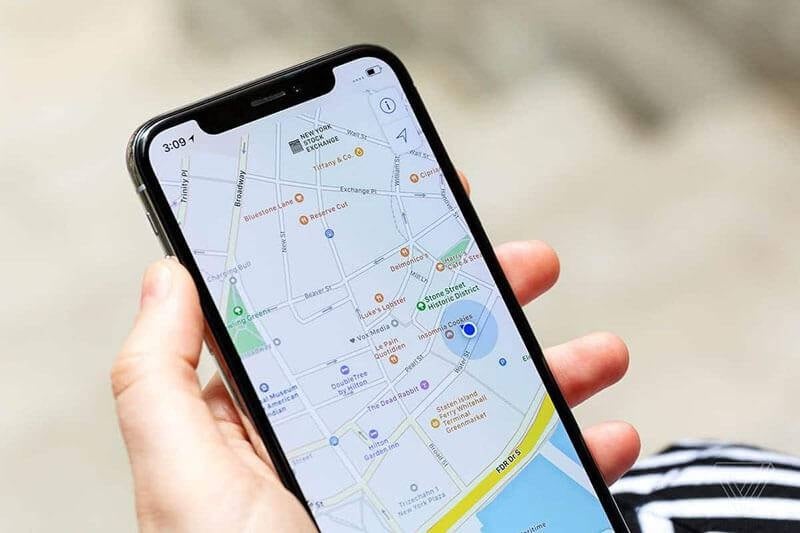 user holding smartphone with map open
