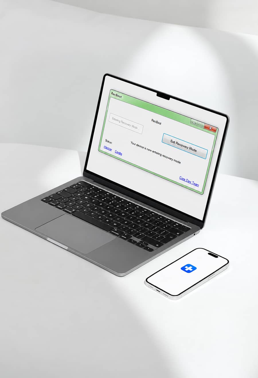 Laptop running RecBoot next to an iPhone