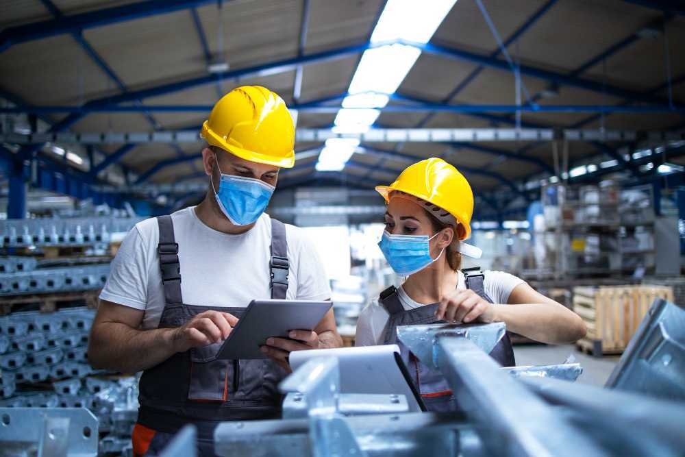 two production workers discussing