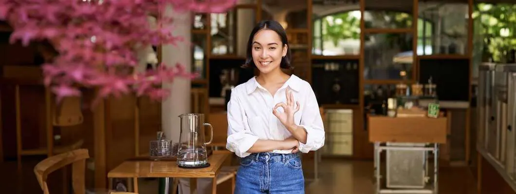 shop house owner giving ok sign