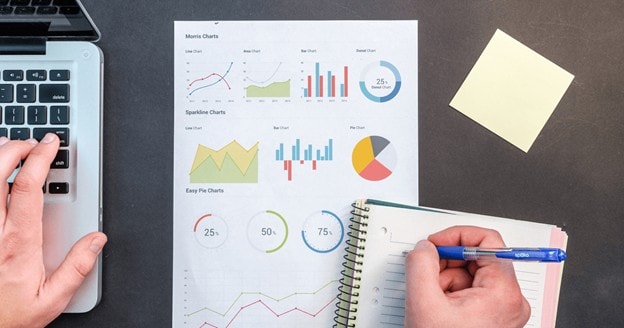 notebook and laptop with charts-work environment