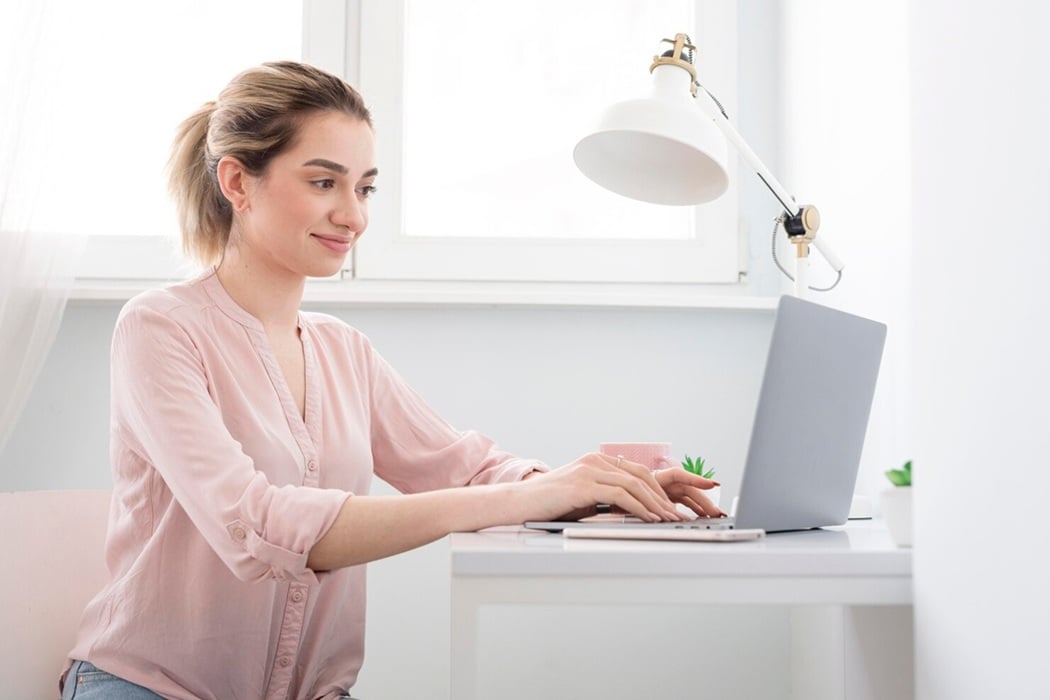 woman-writing narrative essay on laptop