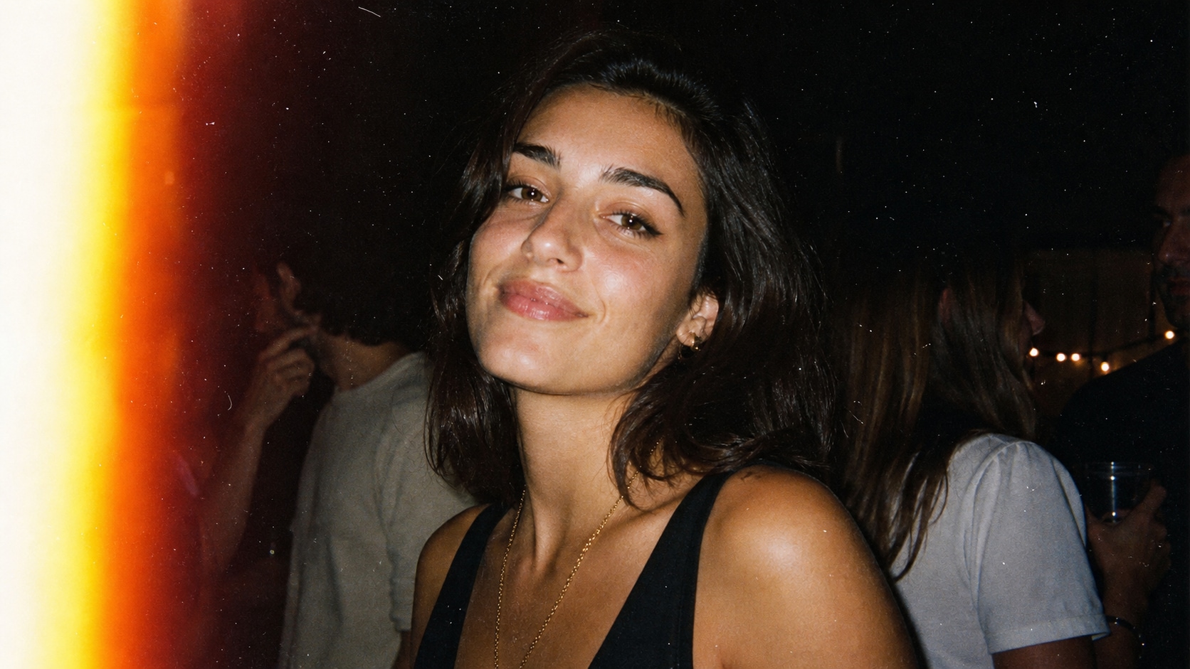 film grain photo prompt feature with light leak and flash detail