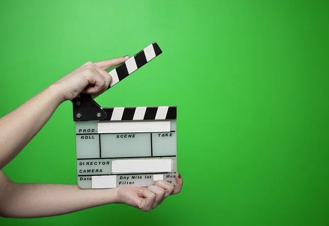 clipper in front of green screen