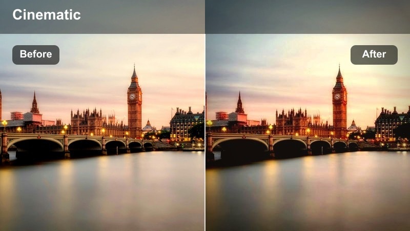 Crowds crossing a city intersection surrounded by tall office buildings at dusk.
