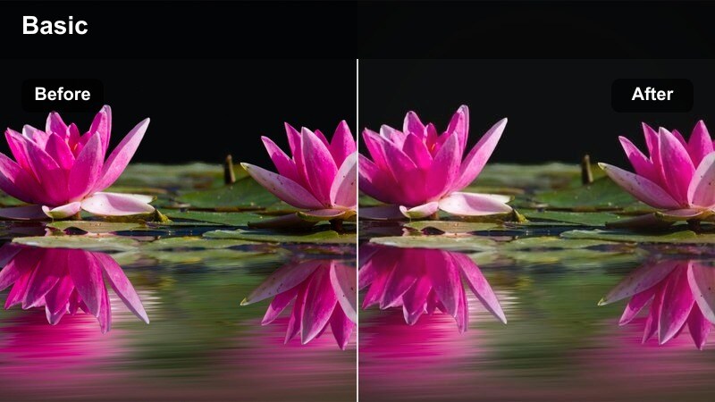 Person standing on a rooftop at blue hour with deep amber cinematic tones in the sky and city lights.