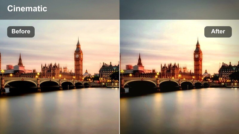 Close-up of hands holding branded shopping bags on a busy sidewalk