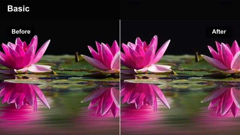 Person standing on a balcony with a mug, soft city skyline in the background.