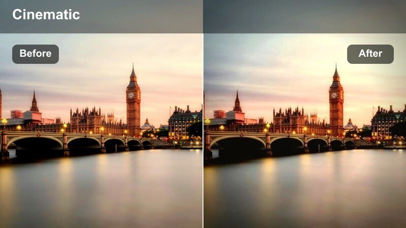Person on a rooftop with a soft, cinematic skyline of tall buildings behind them.