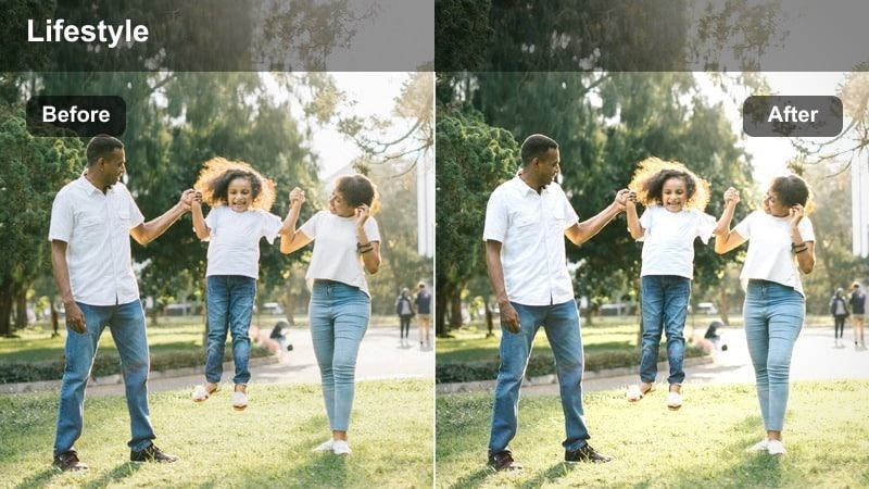 Home vlogger typing on a laptop at a tidy desk near a window in a bright room.