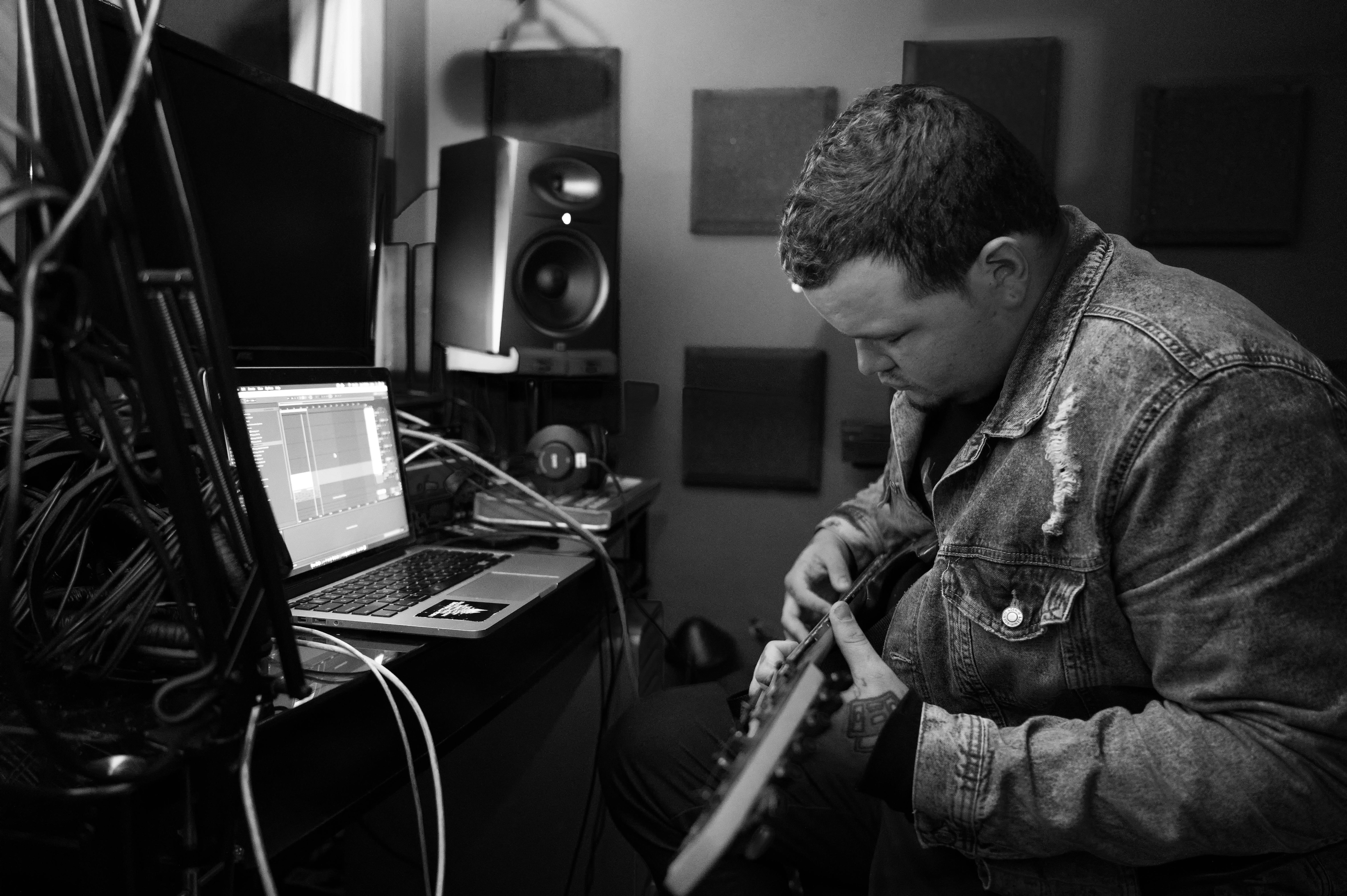 man in a studio with laptop