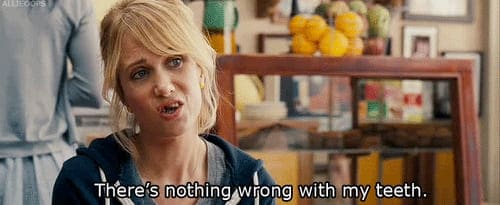 spinach in teeth meme