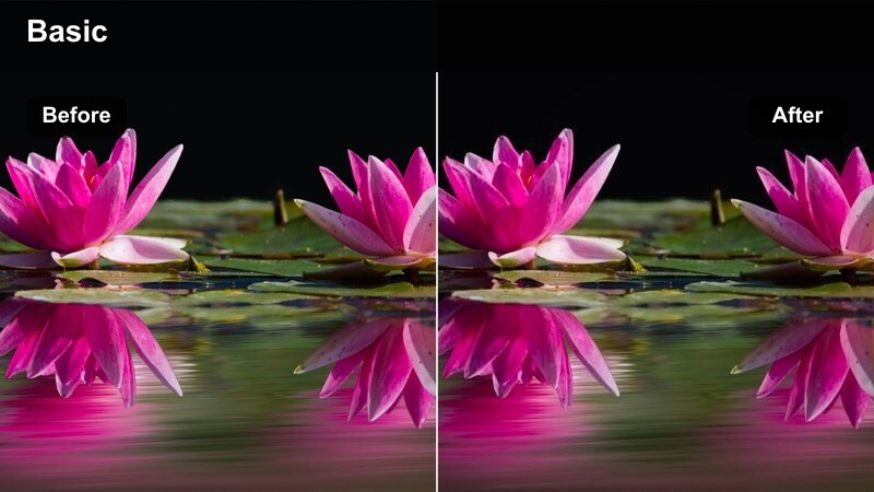 Barista working behind the counter in a dim café lit by warm hanging lights.