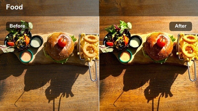 Close-up of whiskey being poured at a dark warm-toned restaurant bar.