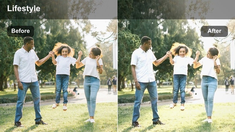 Vlogger walking along a city block during the day carrying a small tote bag.