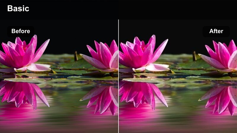 Close-up of hands chopping vegetables on a wooden board under warm, cinematic kitchen lighting.