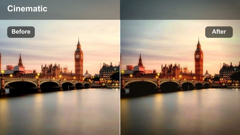 Backlit city skyline with golden edges on tall buildings against a bright sky.