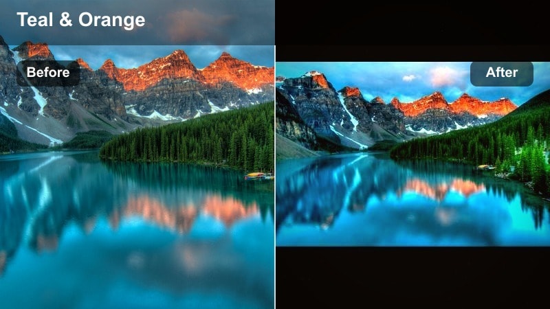 Sunset over a harbor with orange sky and cool blue water reflections.