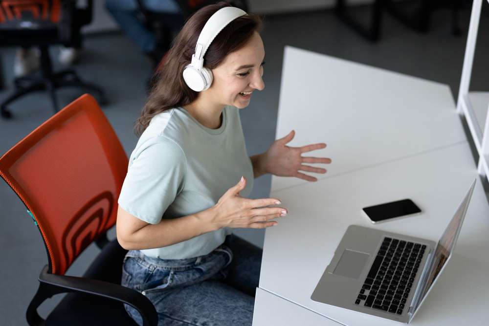 a woman working using a laptop