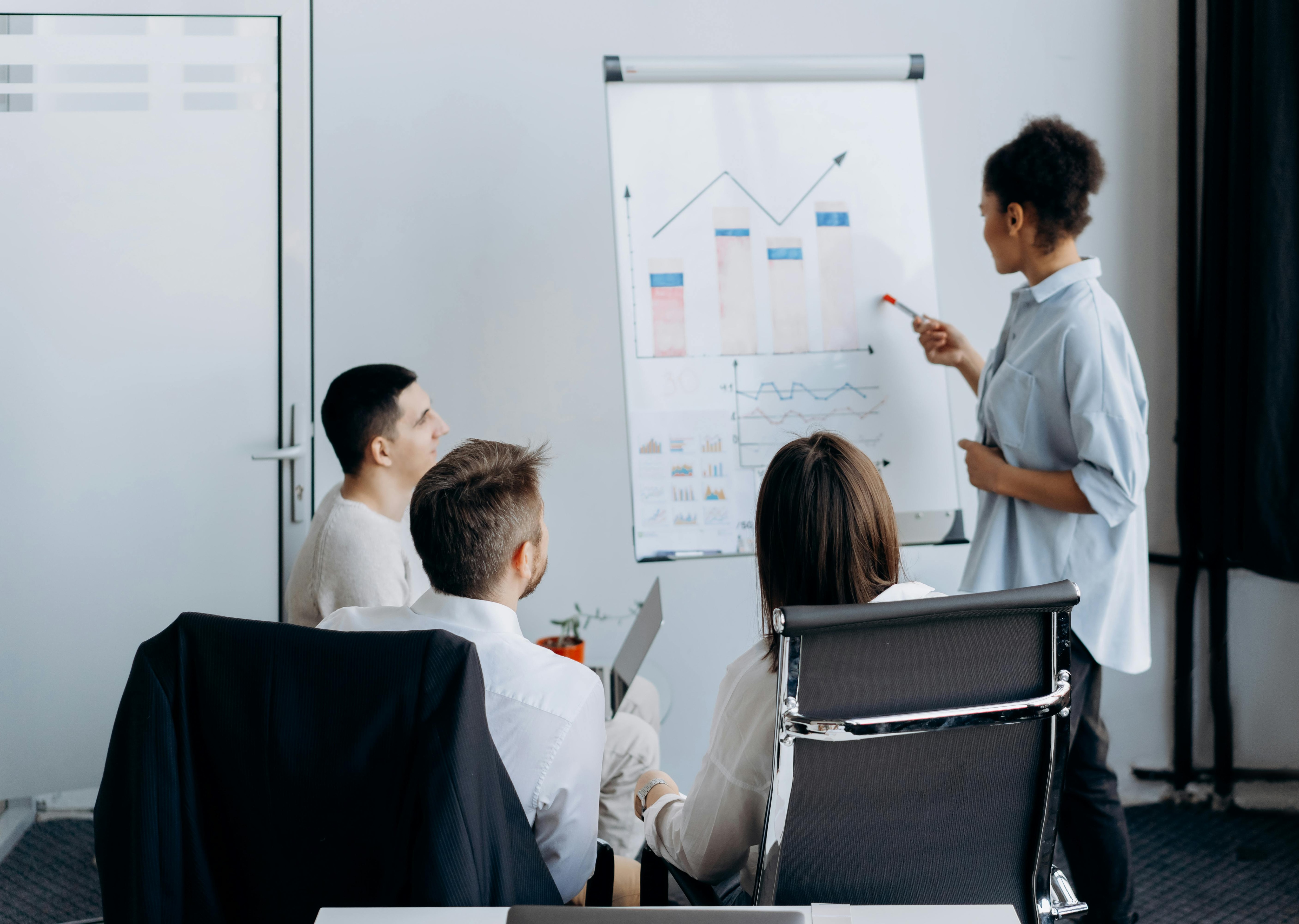 sales leader talking with clients and co employees