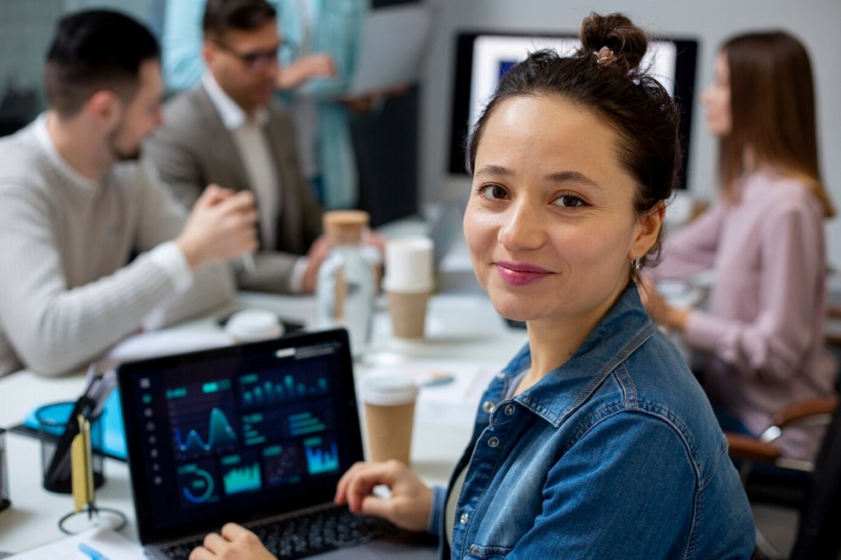 smiling woman using ai automation tools