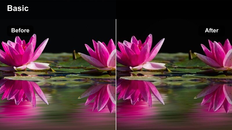 Car speeding through a city at night with blue-toned action movie color.