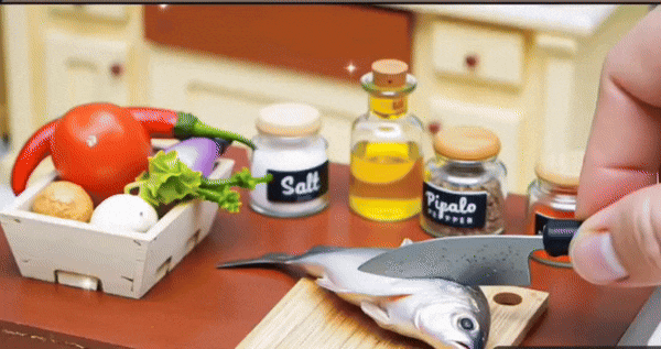 tiny fish cutting in the kitchen