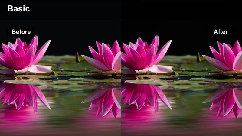 Person sitting on a bed lit by a small lamp with deep shadows in the room.
