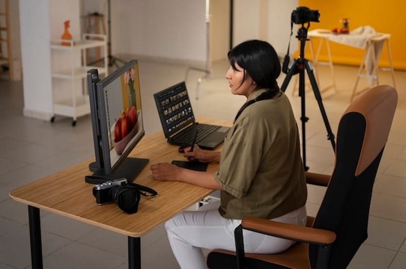 woman editing on computer