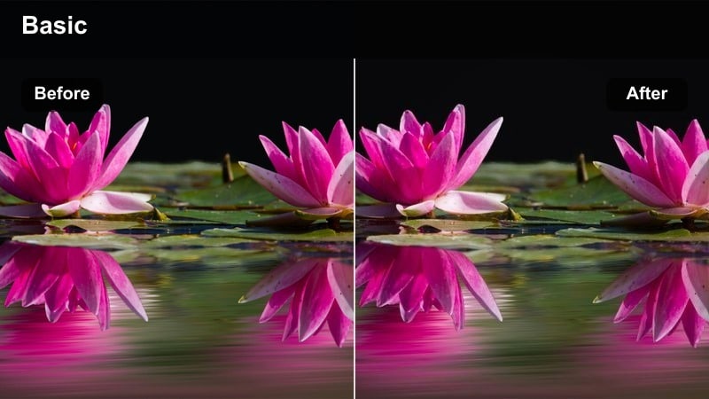 Person working at a small desk in a bedroom at night lit by overhead and desk lamps