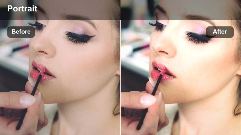 Person leaning on a rooftop bar window rail with amber sunset light on their face and the city skyline behind.