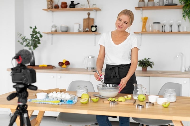 a woman shooting a cooking video