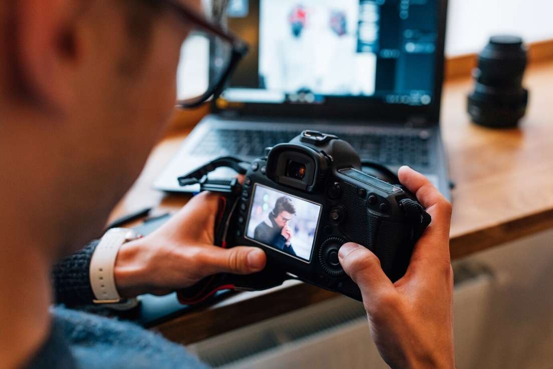 photographer looking at raw photos