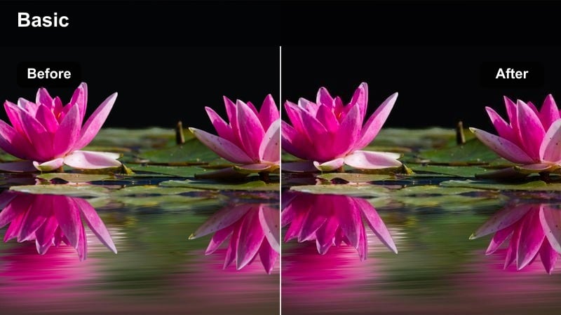 Person relaxing on a couch under warm lamp light during the evening.