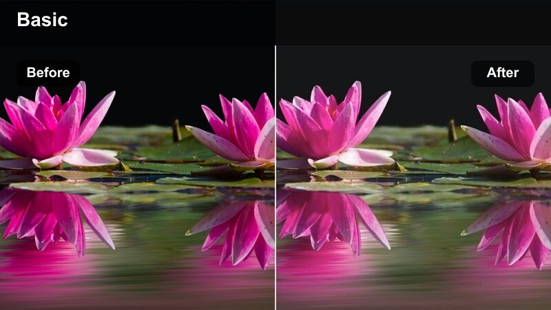 Content creator applying skincare in a bathroom mirror with a soft hazy glow.