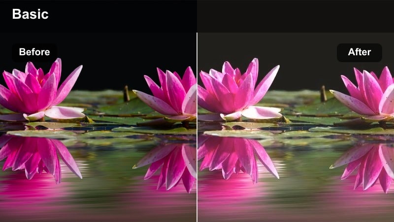 Couple sitting on a city rooftop at sunset with warm hazy light.