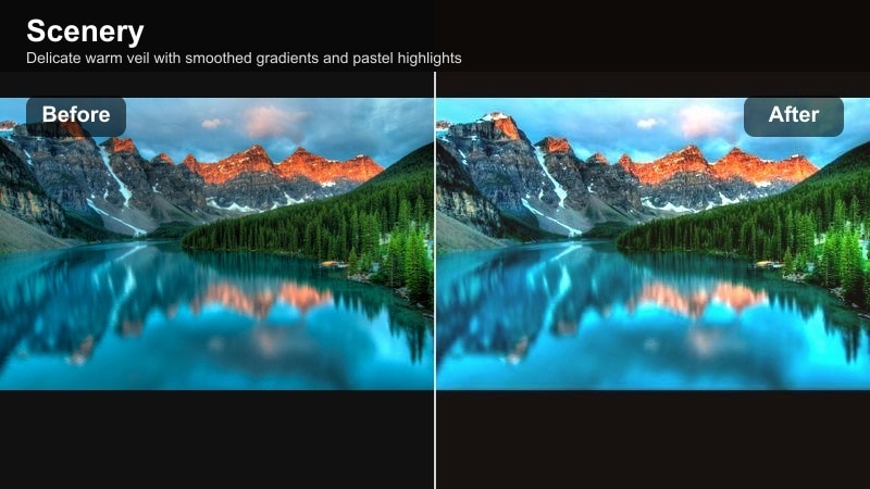 Soft pastel sunset with a warm veil over clouds and hills