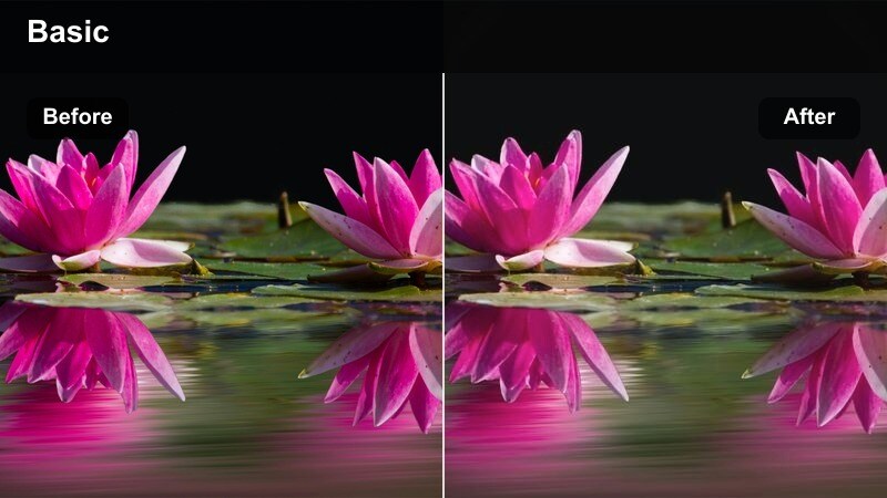 Faded film look of a person looking out a taxi window at blurred city lights at night.