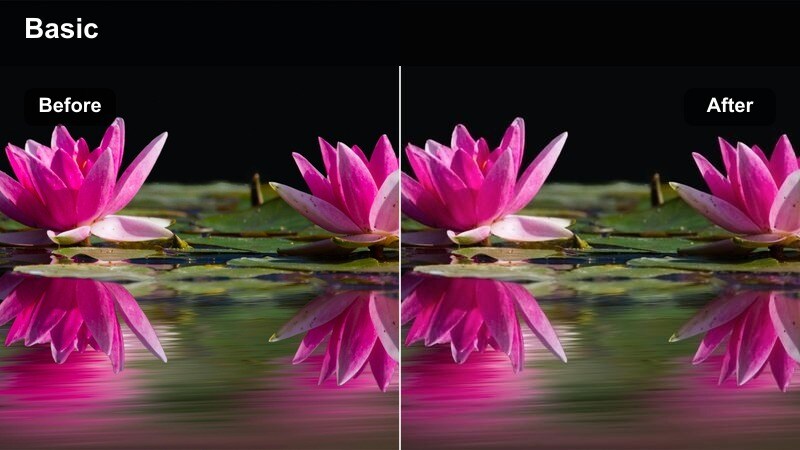 City skyline time-lapse with bright traffic light trails at night.