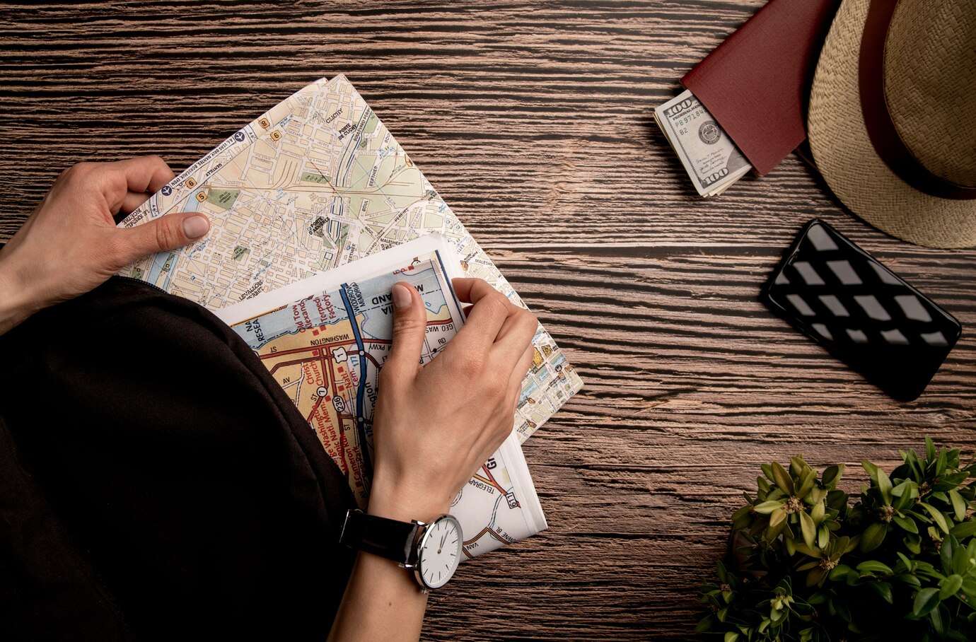 person looking at travel map