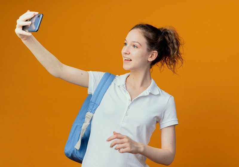 smiling student vlogging