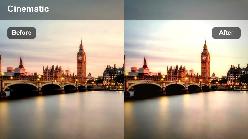 Warm sunset glow over a city rooftop with bright glass reflections on surrounding high-rises.