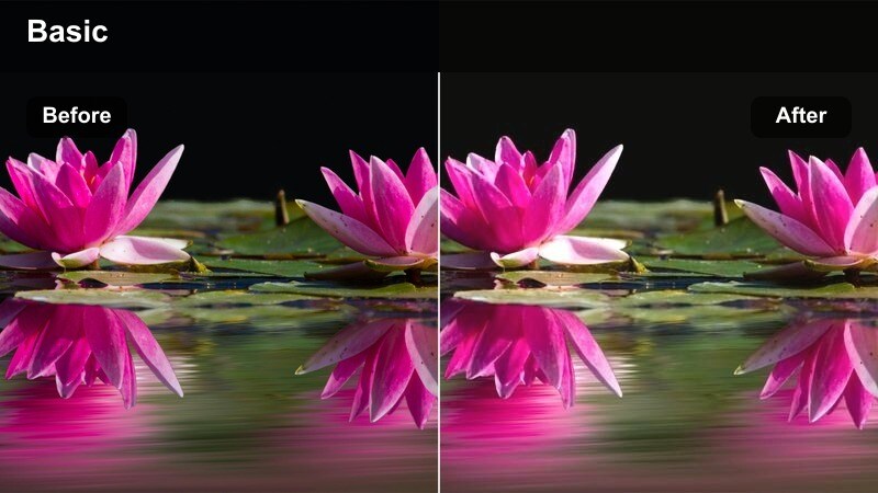 Woman sitting by a large cafè window with warm sunlight and a cup of coffee on the table.