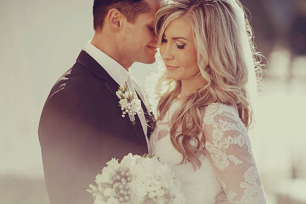Wedding couple with a soft vignette effect for an intimate mood.