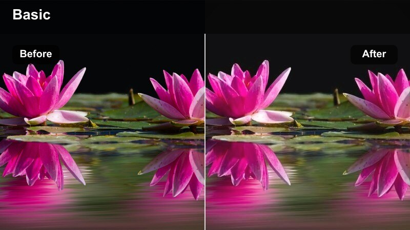 Person talking near an apartment window with warm interior and cool shadow contrast.