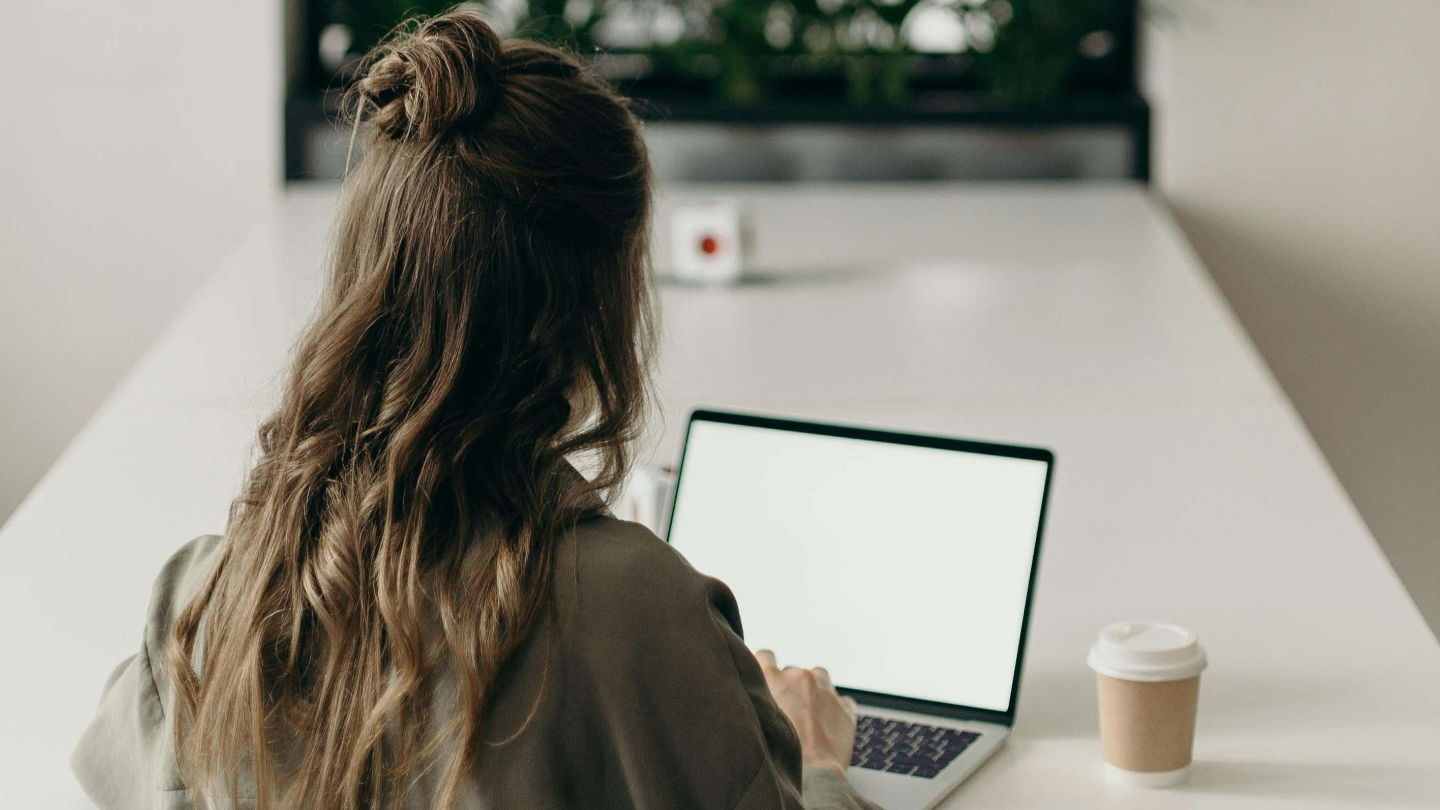 Reviewing a confidential PDF document on a laptop in a secure office workflow