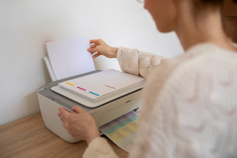 a woman printing a document